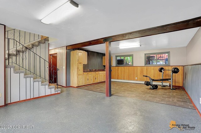 910 S Iris Cir, Palmer, AK 99645 - basement with stairs, wooden walls, and wainscoting