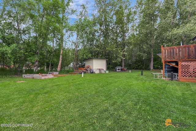 910 S Iris Cir, Palmer, AK 99645 - view of grassy yard with a wooden deck