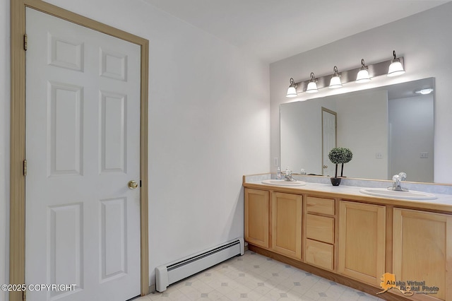 1101 E Dan St, Wasilla, AK 99654 - bathroom with a baseboard heating unit, double vanity, and tile patterned floors