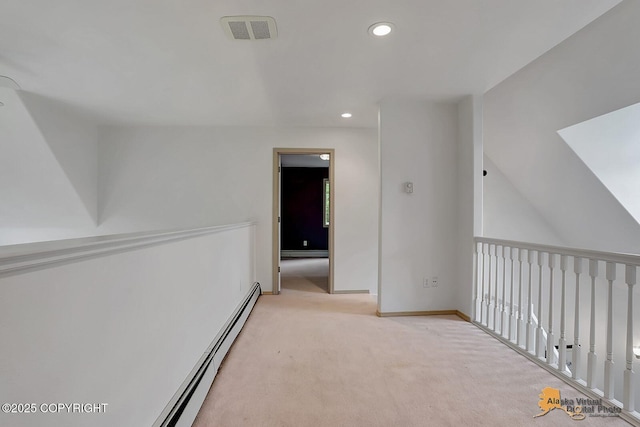 1101 E Dan St, Wasilla, AK 99654 - hallway featuring light carpet, recessed lighting, baseboard heating, and a baseboard radiator