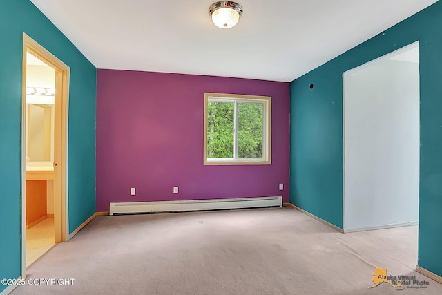 1101 E Dan St, Wasilla, AK 99654 - spare room featuring baseboard heating and carpet floors