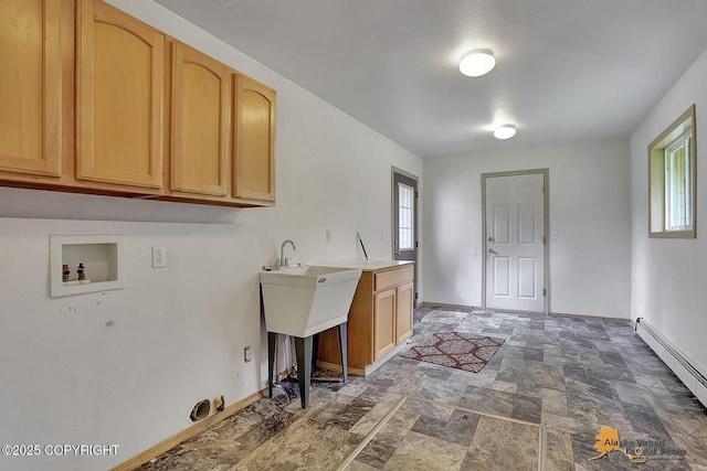 1101 E Dan St, Wasilla, AK 99654 - laundry area featuring cabinet space, hookup for a washing machine, stone finish floors, and a baseboard radiator