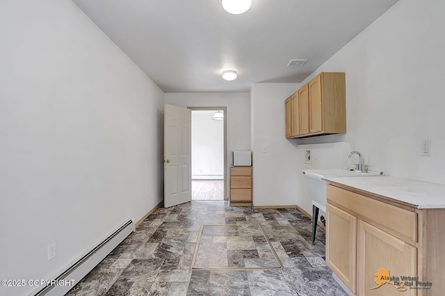 1101 E Dan St, Wasilla, AK 99654 - washroom with washer hookup, cabinet space, baseboard heating, and stone finish flooring
