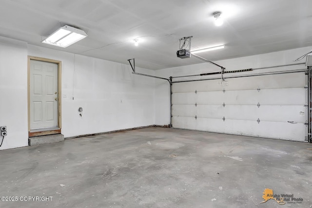 1101 E Dan St, Wasilla, AK 99654 - garage featuring a garage door opener