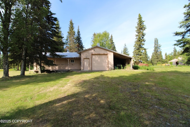 63550 Jessica G Ct, Ninilchik, AK 99639 - view of green lawn featuring a garage