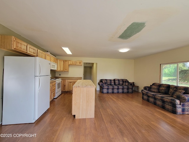 63550 Jessica G Ct, Ninilchik, AK 99639 - kitchen featuring white appliances, light brown cabinetry, open floor plan, light countertops, and dark wood-type flooring