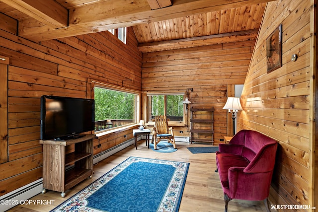 7550 E Fireweed Rd, Palmer, AK 99645 - living area featuring wood walls, a baseboard heating unit, wood ceiling, and wood finished floors
