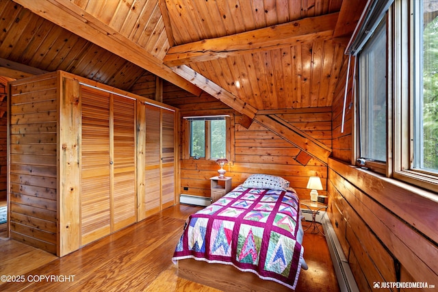 7550 E Fireweed Rd, Palmer, AK 99645 - bedroom featuring wood walls, multiple windows, wood finished floors, wooden ceiling, and baseboard heating