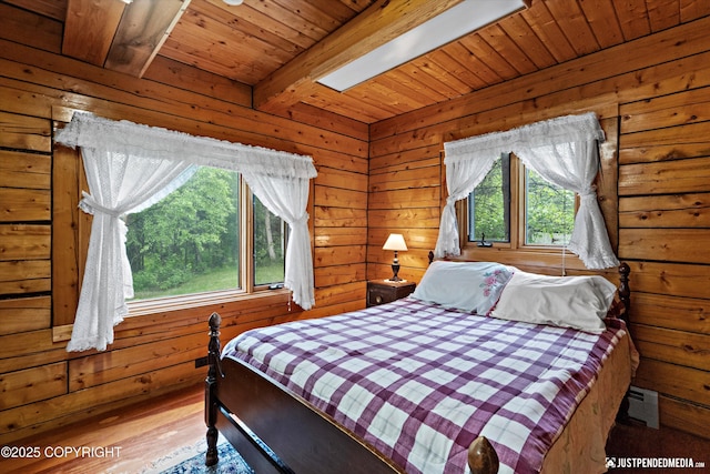 7550 E Fireweed Rd, Palmer, AK 99645 - bedroom with wooden ceiling with exposed beams, wood walls, and wood finished floors