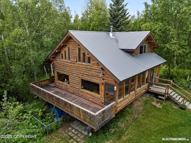 7550 E Fireweed Rd, Palmer, AK 99645 - rear view of house with log exterior, stairs, and a wooden deck