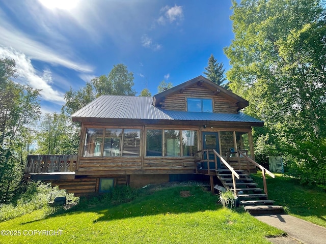 7550 E Fireweed Rd, Palmer, AK 99645 - log-style house featuring a front yard, log exterior, stairway, metal roof, and a porch