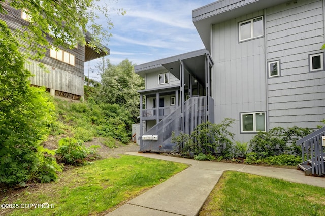 836 O Pl, Anchorage, AK 99501 - surrounding community with stairway and a yard