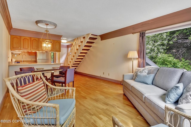 836 O Pl, Anchorage, AK 99501 - living room with light wood-style flooring, baseboards, and a textured ceiling