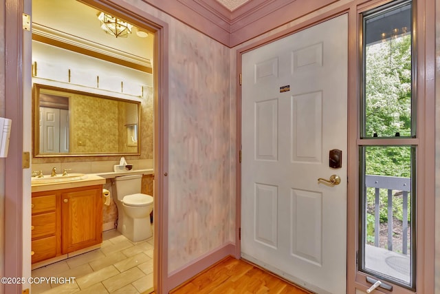 836 O Pl, Anchorage, AK 99501 - bathroom with vanity, toilet, and crown molding