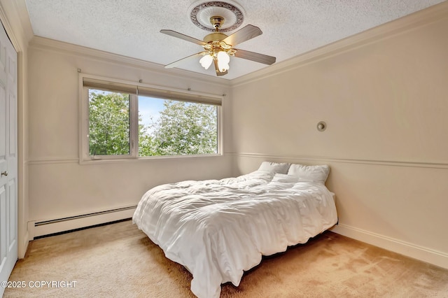836 O Pl, Anchorage, AK 99501 - bedroom with baseboard heating, a textured ceiling, carpet flooring, crown molding, and baseboards