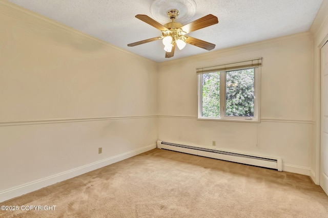 836 O Pl, Anchorage, AK 99501 - carpeted spare room with baseboard heating, baseboards, a ceiling fan, and a textured ceiling