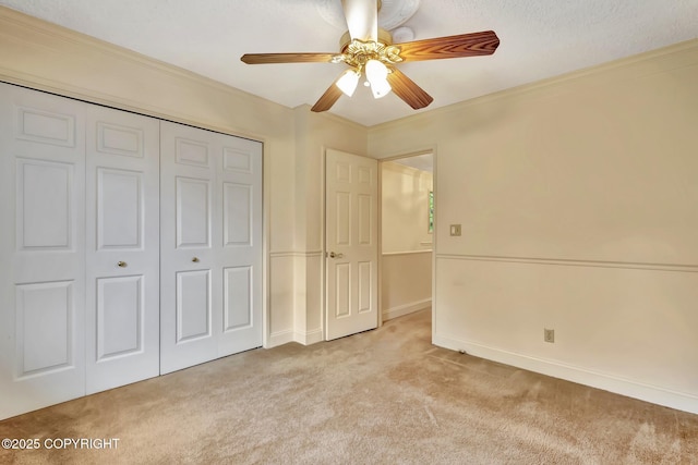 836 O Pl, Anchorage, AK 99501 - unfurnished bedroom featuring carpet, a closet, a ceiling fan, baseboards, and ornamental molding