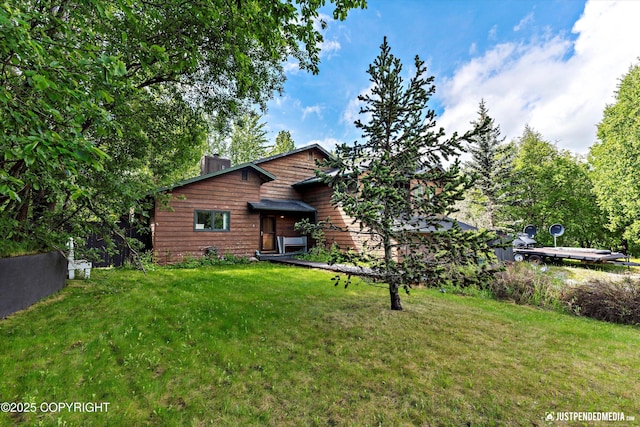 2020 N Kentucky Derby Dr, Palmer, AK 99645 - chalet / cabin featuring a chimney and a front yard