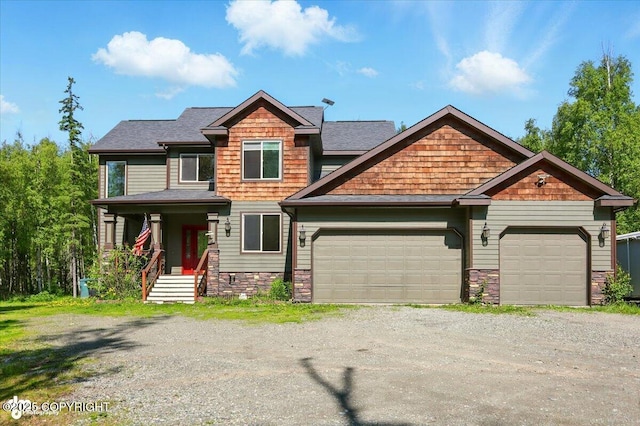 4920 W Fairview Loop, Wasilla, AK 99654 - craftsman inspired home with driveway, a garage, stone siding, and a shingled roof