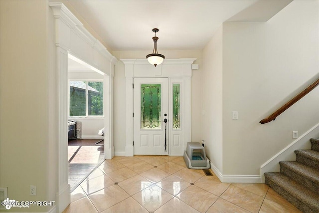 4920 W Fairview Loop, Wasilla, AK 99654 - entrance foyer featuring heating unit, light tile patterned floors, and stairs