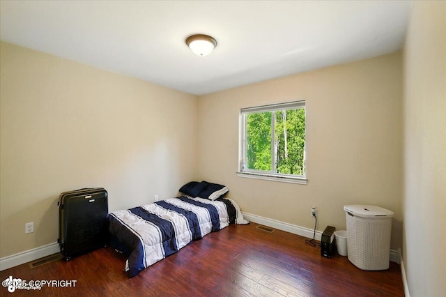4920 W Fairview Loop, Wasilla, AK 99654 - bedroom with baseboards and wood finished floors