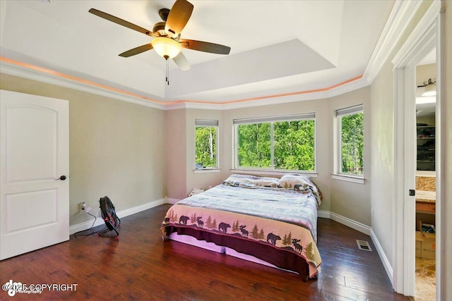 4920 W Fairview Loop, Wasilla, AK 99654 - bedroom featuring a tray ceiling, hardwood / wood-style flooring, ornamental molding, and ceiling fan