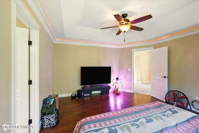 4920 W Fairview Loop, Wasilla, AK 99654 - bedroom featuring a raised ceiling, wood finished floors, crown molding, and ceiling fan
