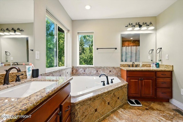 4920 W Fairview Loop, Wasilla, AK 99654 - full bathroom featuring plenty of natural light, two vanities, a jetted tub, and a shower with curtain