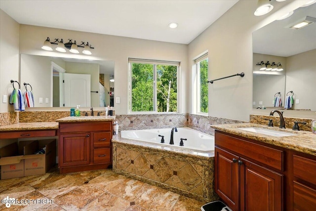 4920 W Fairview Loop, Wasilla, AK 99654 - bathroom featuring two vanities and a garden tub