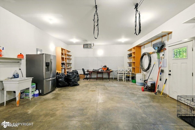 4920 W Fairview Loop, Wasilla, AK 99654 - garage featuring stainless steel fridge with ice dispenser