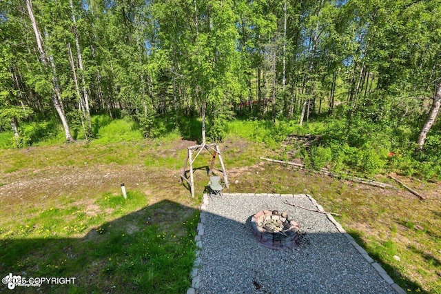 4920 W Fairview Loop, Wasilla, AK 99654 - view of yard featuring an outdoor fire pit