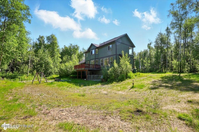 4920 W Fairview Loop, Wasilla, AK 99654 - back of property with a wooden deck and a forest view