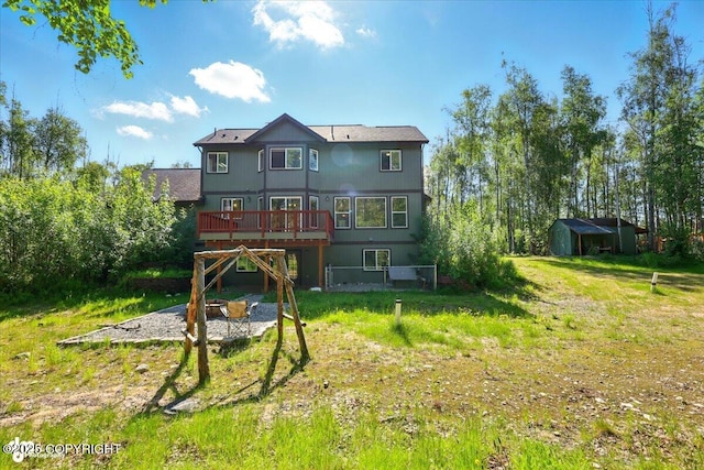4920 W Fairview Loop, Wasilla, AK 99654 - rear view of property with a deck, a shed, and a lawn