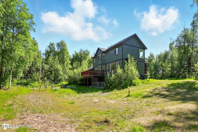 4920 W Fairview Loop, Wasilla, AK 99654 - rear view of property featuring a wooden deck and a forest view