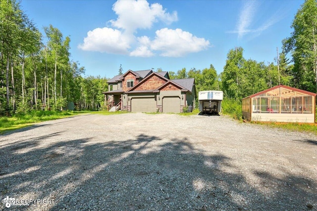 4920 W Fairview Loop, Wasilla, AK 99654 - view of front of property with gravel driveway and an attached garage