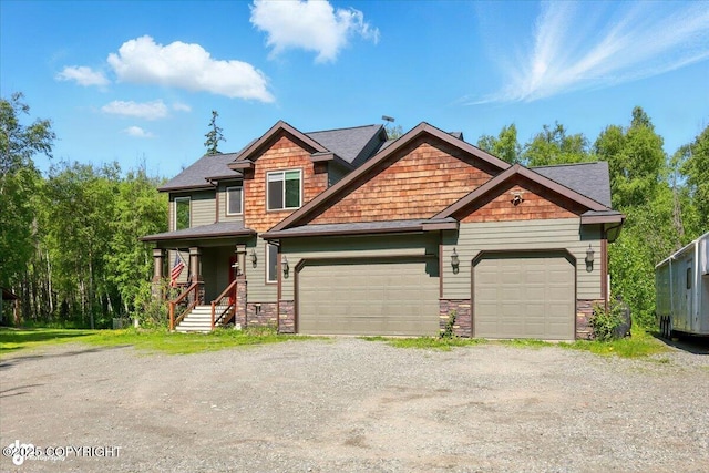4920 W Fairview Loop, Wasilla, AK 99654 - craftsman-style house with stone siding, driveway, and a garage