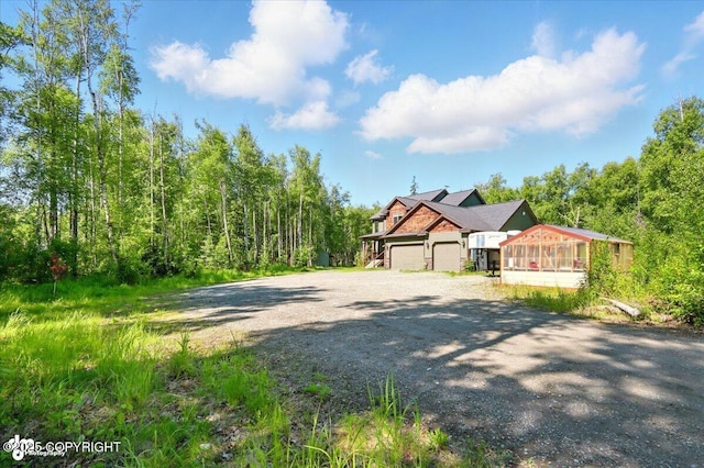 4920 W Fairview Loop, Wasilla, AK 99654 - view of front of home featuring gravel driveway and a garage