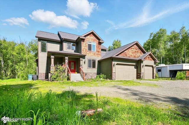 4920 W Fairview Loop, Wasilla, AK 99654 - craftsman-style house featuring a garage, stone siding, and driveway