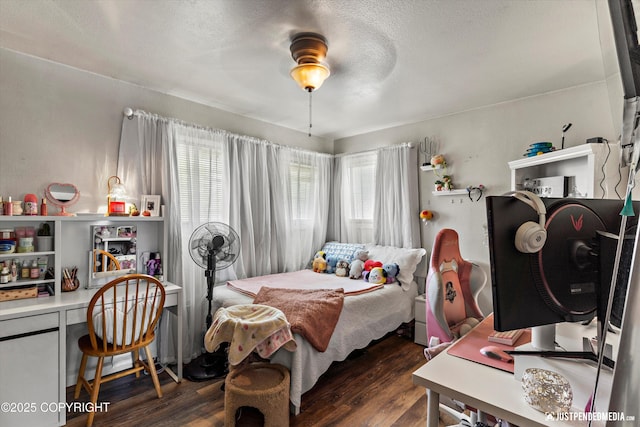 4417 San Roberto Ave, Anchorage, AK 99508 - bedroom with dark wood-style floors, a desk, and a textured ceiling