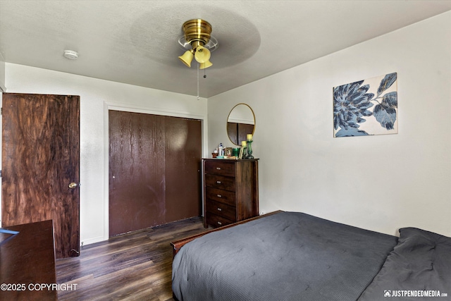 4417 San Roberto Ave, Anchorage, AK 99508 - bedroom with wood finished floors, a closet, and a ceiling fan