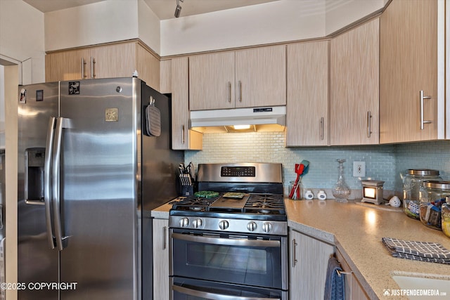 4417 San Roberto Ave, Anchorage, AK 99508 - kitchen featuring stainless steel appliances, under cabinet range hood, backsplash, and light brown cabinetry