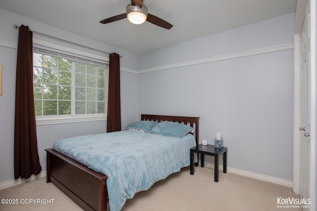 2690 E Tamarak Ave, Wasilla, AK 99654 - bedroom with light colored carpet, a ceiling fan, and baseboards