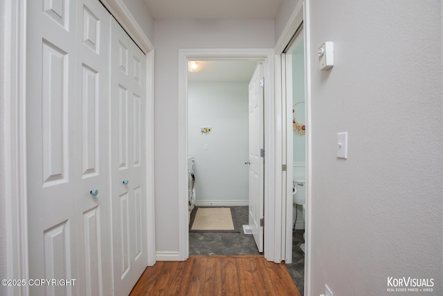2690 E Tamarak Ave, Wasilla, AK 99654 - corridor featuring wood finished floors, baseboards, and washer / dryer