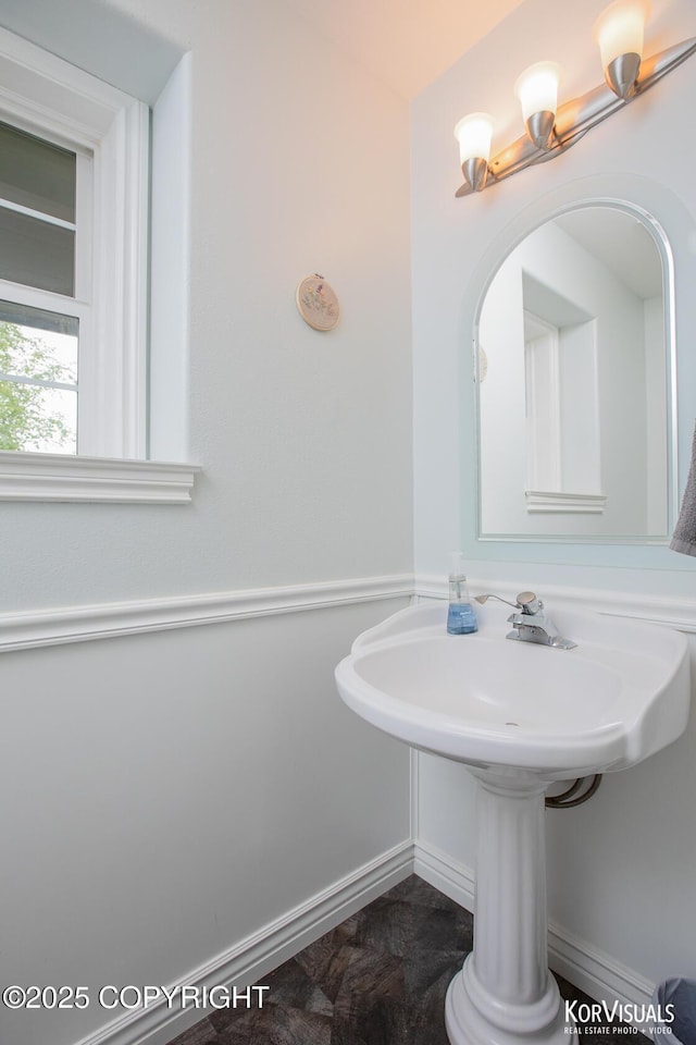 2690 E Tamarak Ave, Wasilla, AK 99654 - bathroom featuring baseboards