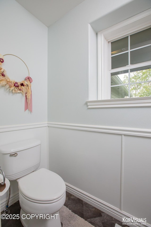 2690 E Tamarak Ave, Wasilla, AK 99654 - bathroom featuring toilet and baseboards