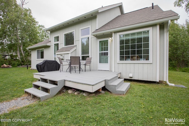 2690 E Tamarak Ave, Wasilla, AK 99654 - rear view of property with a wooden deck, a lawn, a shingled roof, and outdoor dining area