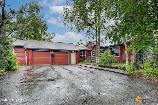 3200 E 15th Ave, Anchorage, AK 99508 - view of front of home with asphalt driveway and an attached garage