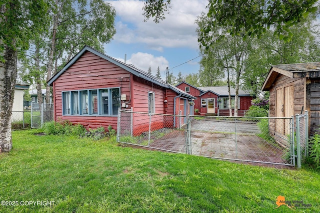 3200 E 15th Ave, Anchorage, AK 99508 - back of house featuring a gate and a patio area