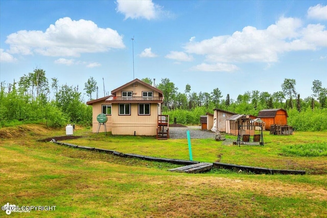 14617 N Crystal Lake Rd, Willow, AK 99688 - back of house with a lawn and an outbuilding
