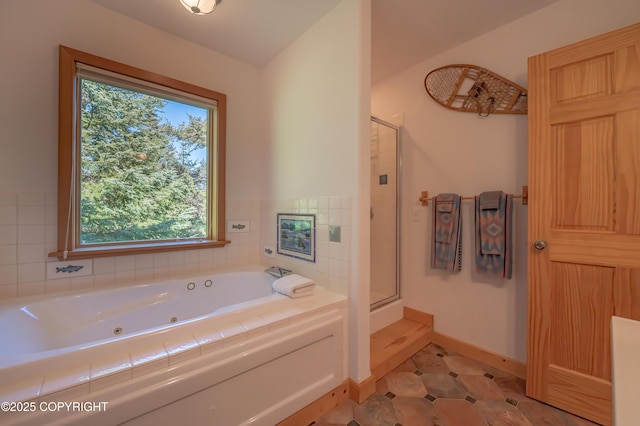 2032 Horizon Ct, Homer, AK 99603 - bathroom featuring a jetted tub, a stall shower, and baseboards